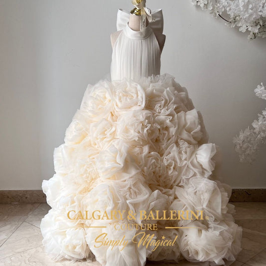 White floral dress on a mannequin with 'Calgary & Ballerini Couture' branding.