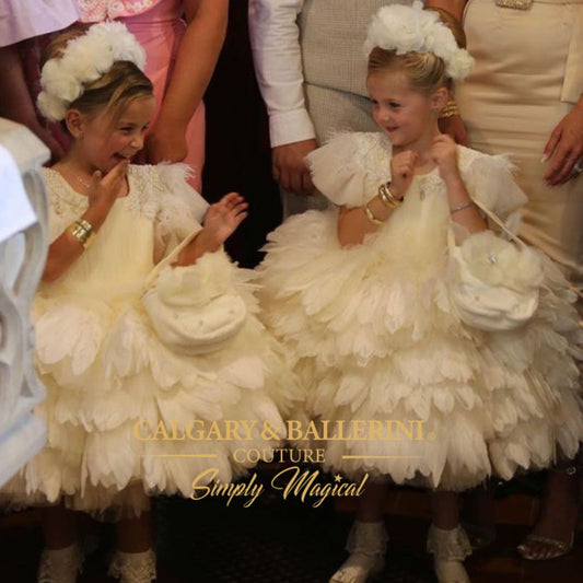 Couture baptism gown for girls featuring tulle and floral appliqués
