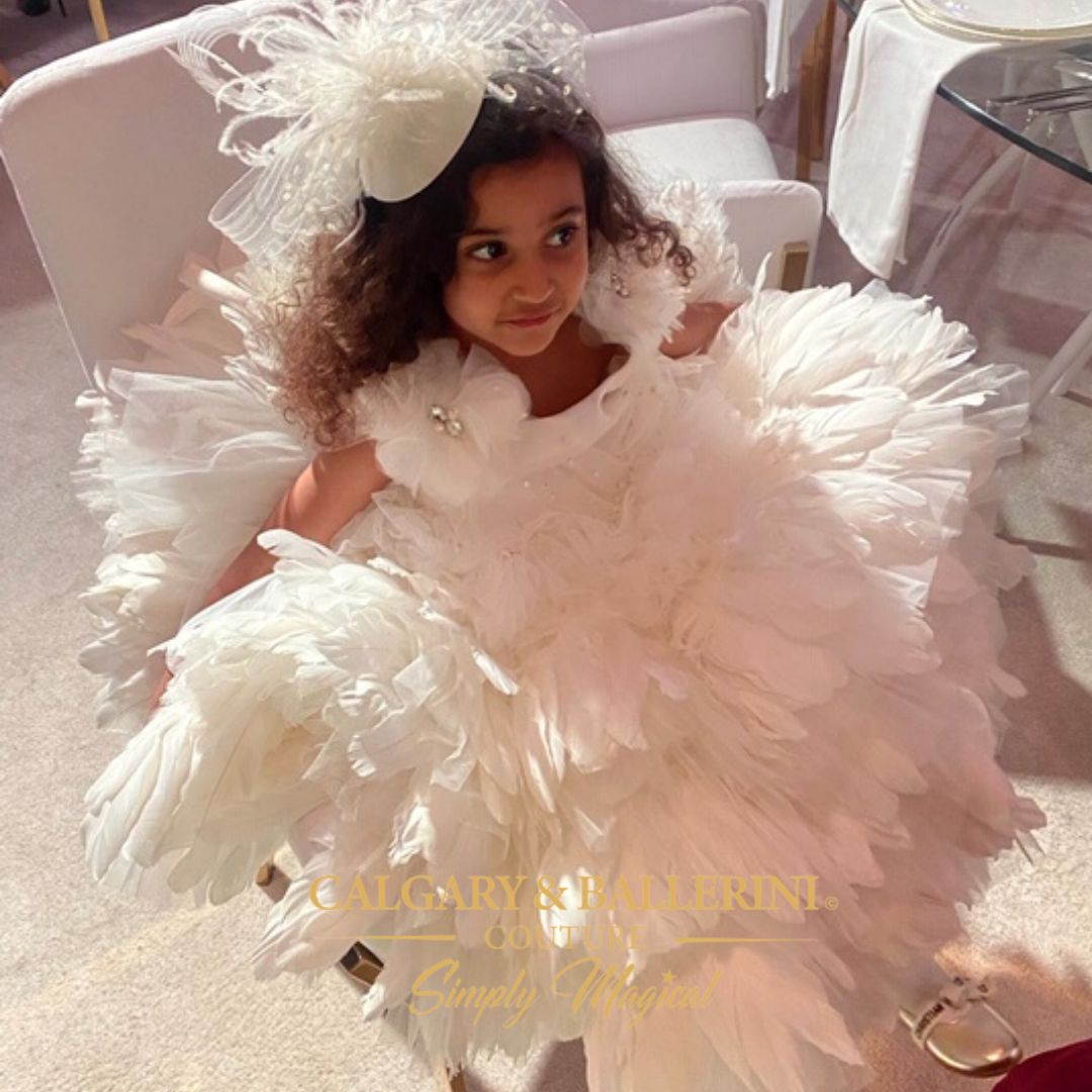 Gowns with feathers Kids Couture | Ages 1–8 | $1,000–$2,500
