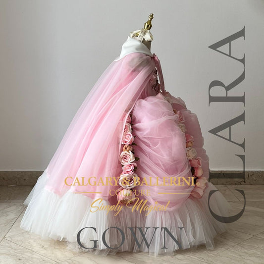 Experience the enchantment of 'The Nutcracker' with our custom Clara costume. A floor-length ballgown, luxurious cape, and intricate lace details await your little princess. Elevate her fairytale moments—shop now at www.calgaryandballerini.com 