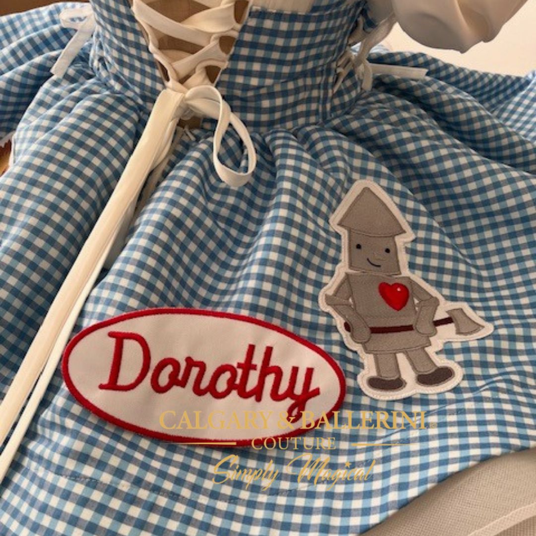 Order bespoke blue gingham Dorothy first birthday matching dresses, artisan handcrafted with storybook character embroidery for luxury celebrations.