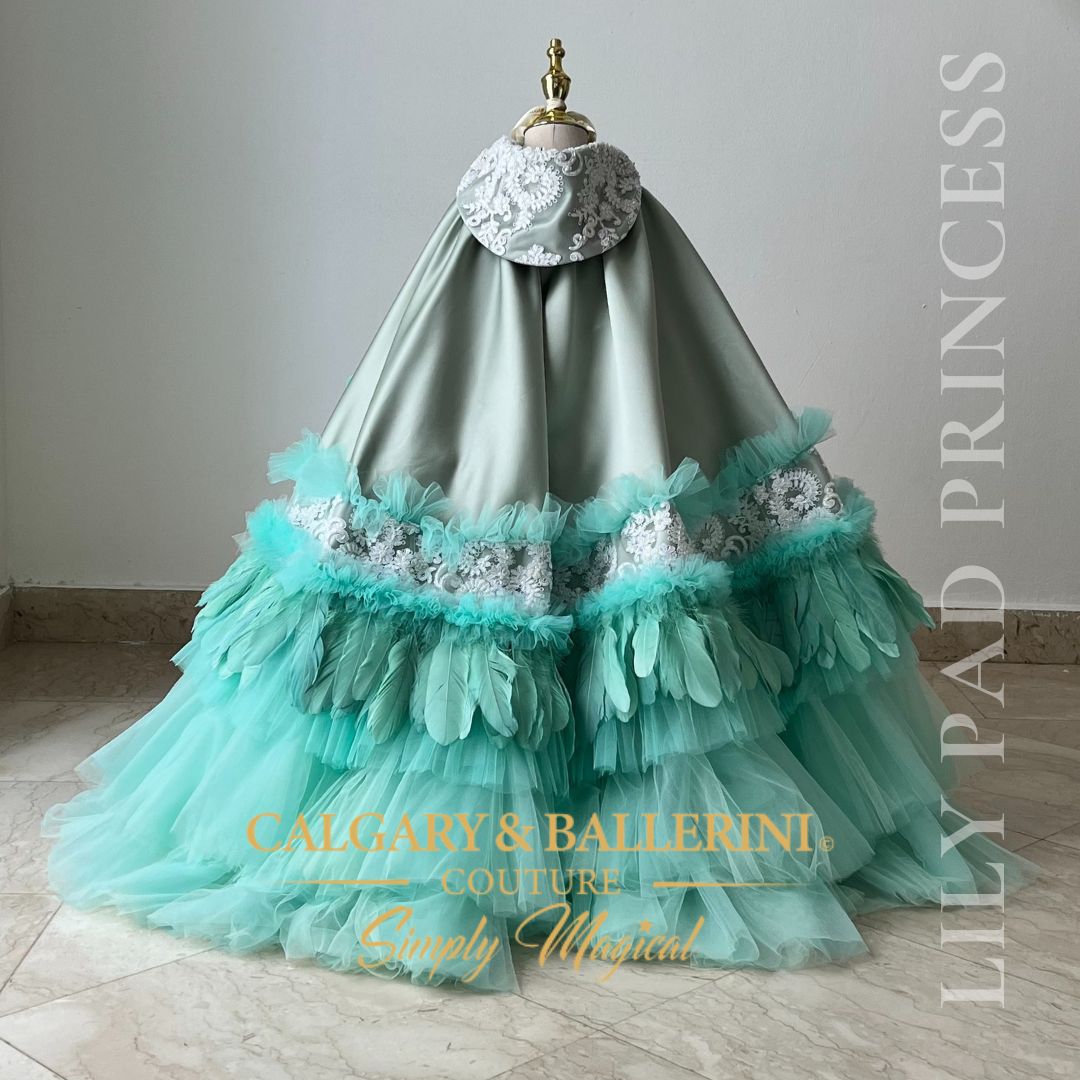 Order our bespoke Tiana first birthday dress, a luxury petal ball gown with a couture cape, artisan handcrafted for 2026 milestone parties.