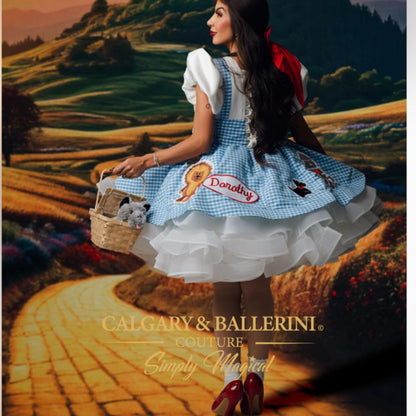 Buy our luxury mommy and me Wizard of Oz matching dresses in blue gingham, featuring bespoke embroidery of Dorothy, Lion, and Tin Man by Calgary and Ballerini.