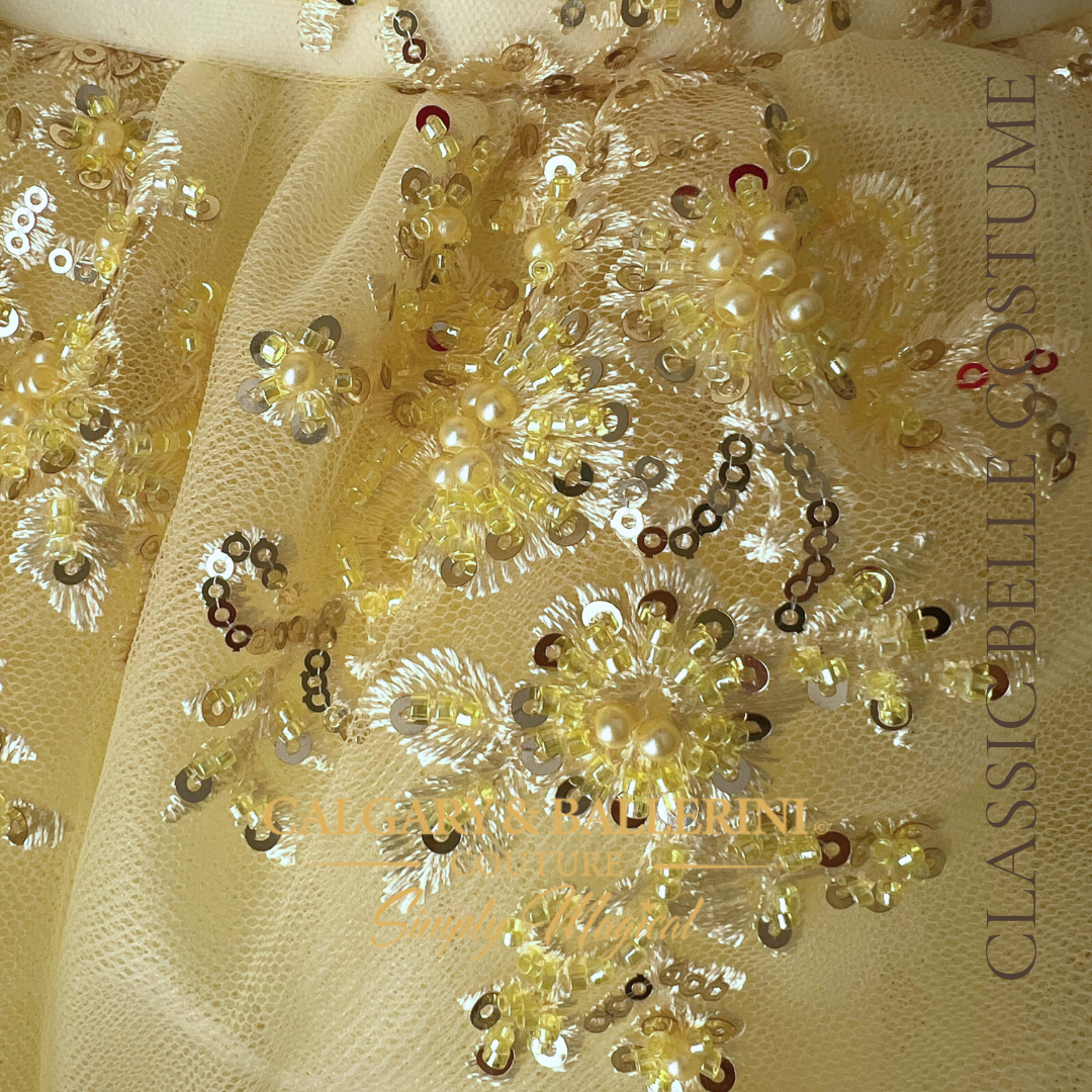 yellow lace close up from skirt fabric with sequins and small pearls 