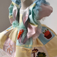 Close-up of Easter bunny embroidery and pastel fabric on toddler spring dress