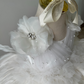 Stunning flower girl dress made with white feathers and satin bodice, perfect for weddings and milestone celebrations.