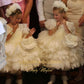  Couture flower girl gown featuring tulle and floral appliqués