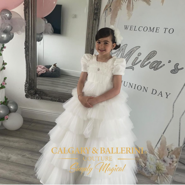 White ruffle communion dress with puff sleeves