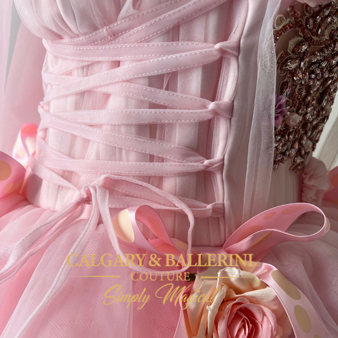 Couture adult princess gown in pink with tulle fabric, roses, and cape, perfect for adult princess costumes and accessories