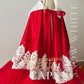 Luxury child’s cape with red ruffles and white collar