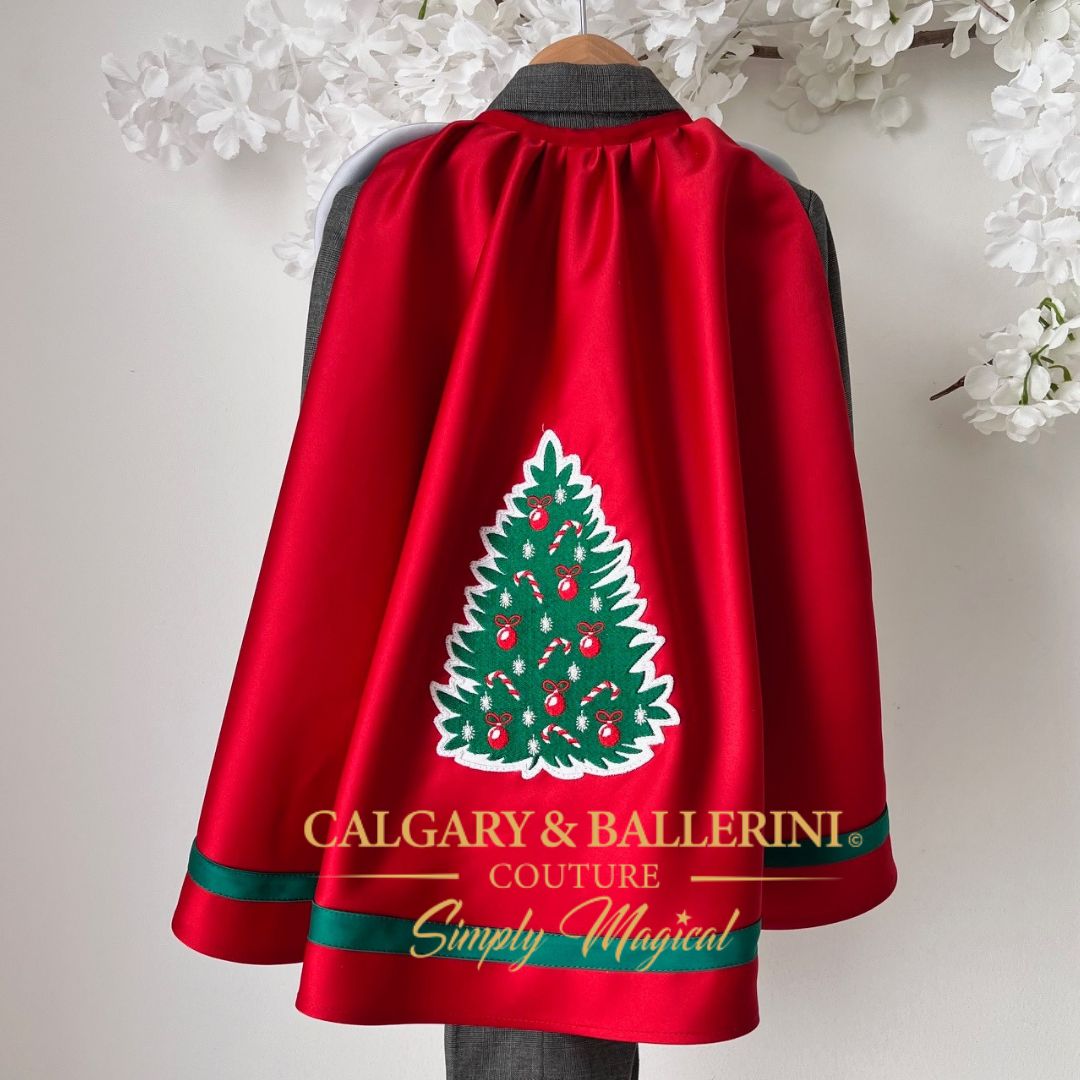 Children’s luxury Christmas outfit with red satin cape and festive jacket
