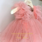 Peach princess birthday dress with couture design and goose feather bottom.