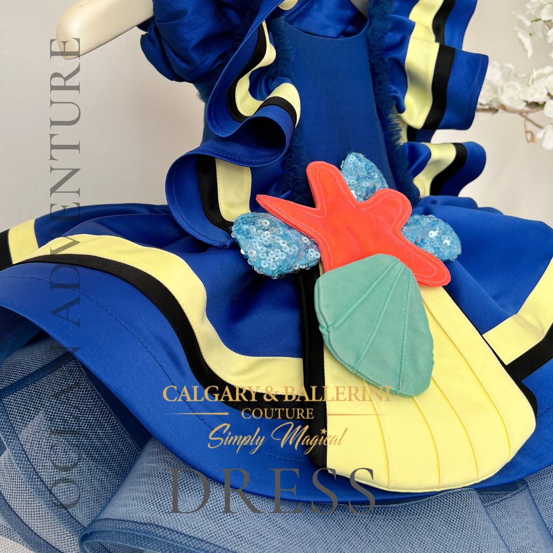 Disney costume -  finding Dory costume toddler girls - close up of sea shell and yellow tail fin datils on skirt 