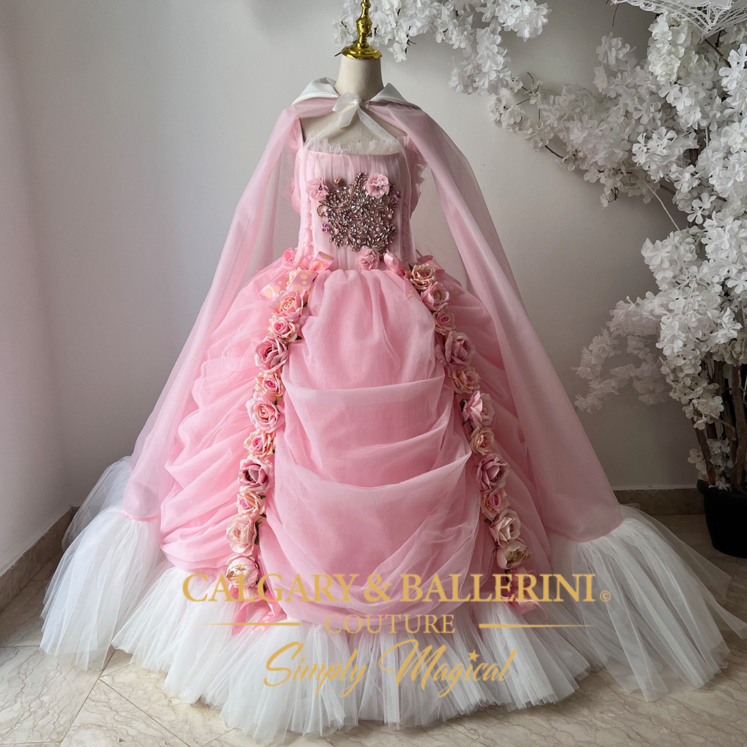 Pink Victorian-style ball gown for adults with tulle fabric, floor-length cape, and rose details, perfect for an adult princess dress