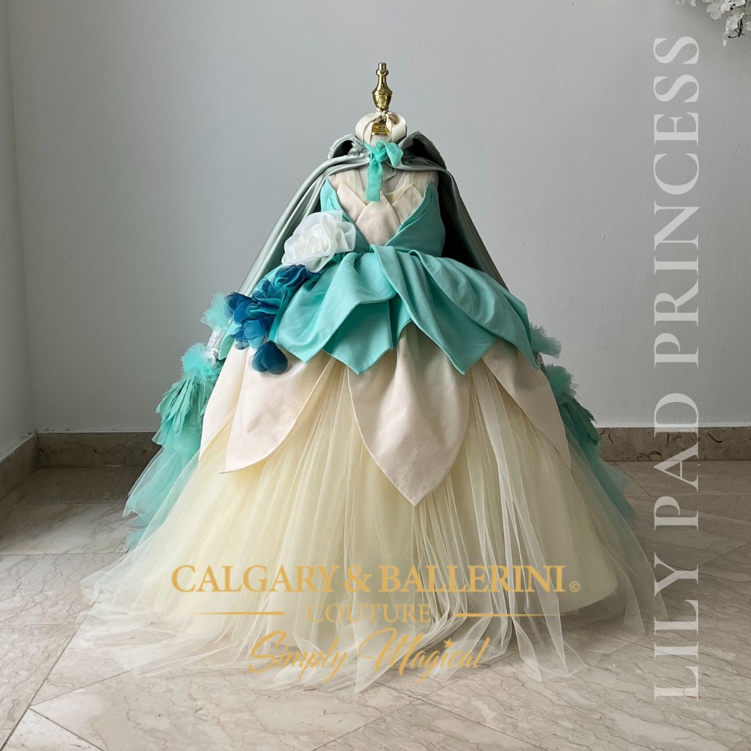 Shop our luxury Tiana theme birthday dress featuring a 3D petal ball gown skirt and matching cape, perfect for investment-piece party photos.