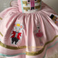 buy  $799 Nutcracker Gown showing the ruffle train and large bow