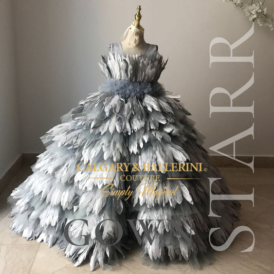 Floor-length silver feather dress with shimmering details, perfect for weddings and special occasions