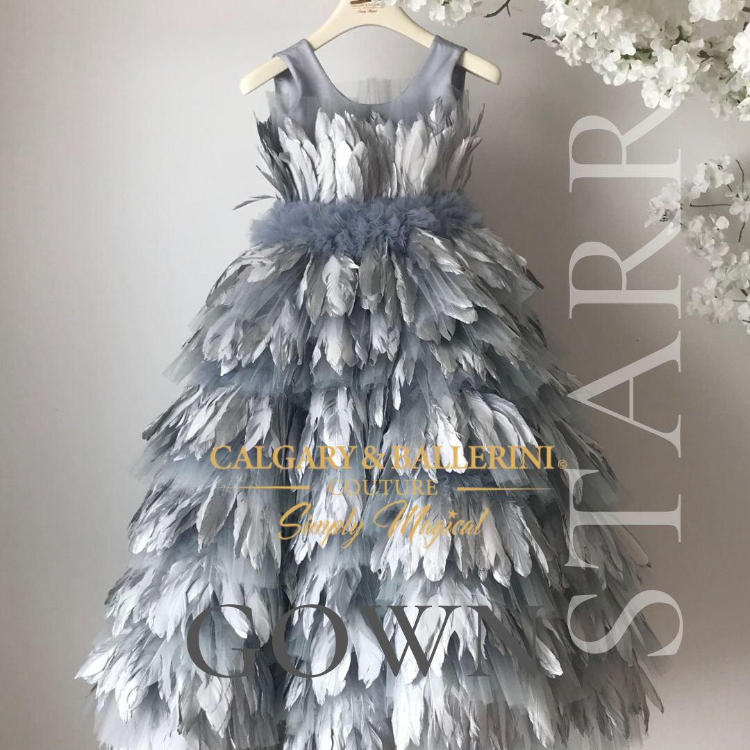 Indulge in the opulence of our Starr Silver Feather Dress, designed to make your wedding day a vision of timeless beauty. This couture masterpiece features a floor-length silhouette adorned with delicate silver feathers, evoking a sense of ethereal allure.
