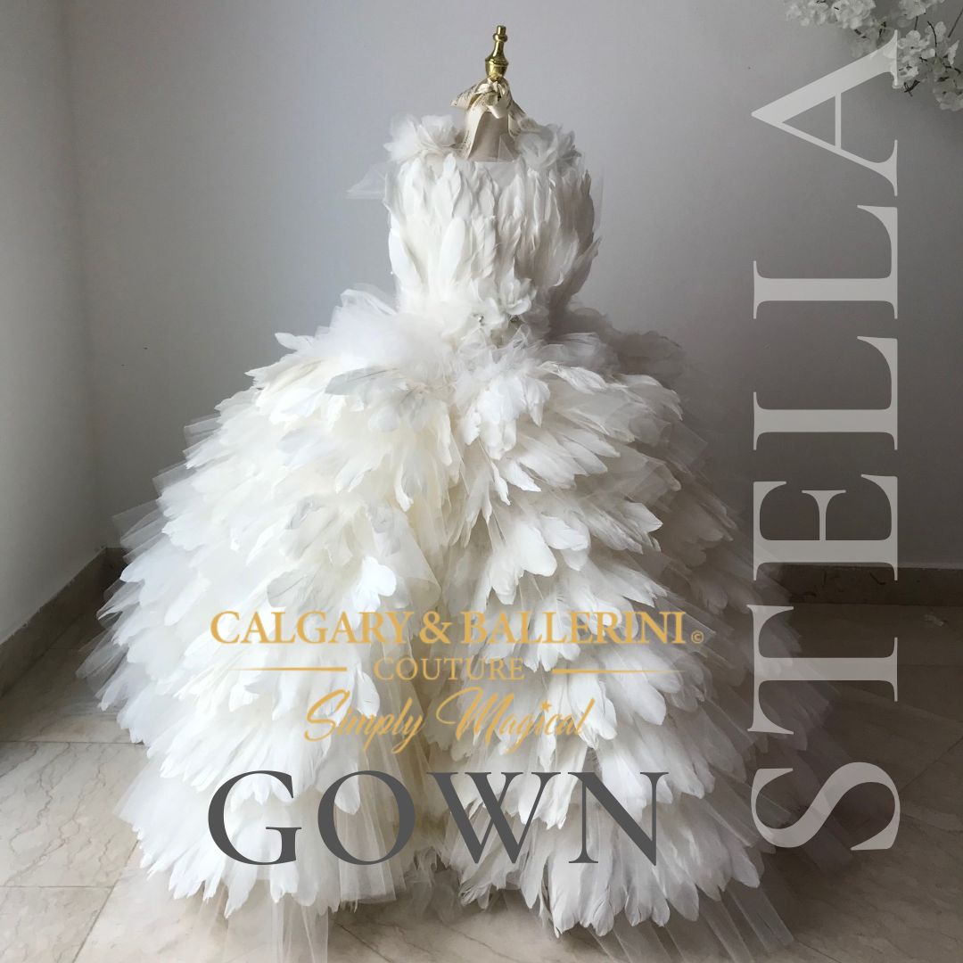 Step into a world of couture craftsmanship and discover our carefully curated selection of floor-length feather dresses. Each dress in our collection is designed to evoke a sense of enchantment and make your flower girls feel like the princesses they truly are