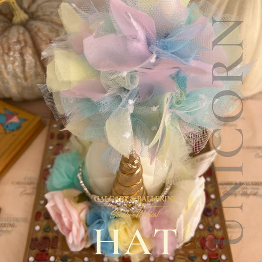 Luxury unicorn birthday party hat featuring pastel tones, pom-poms, and sparkling details, perfect for kids and adults