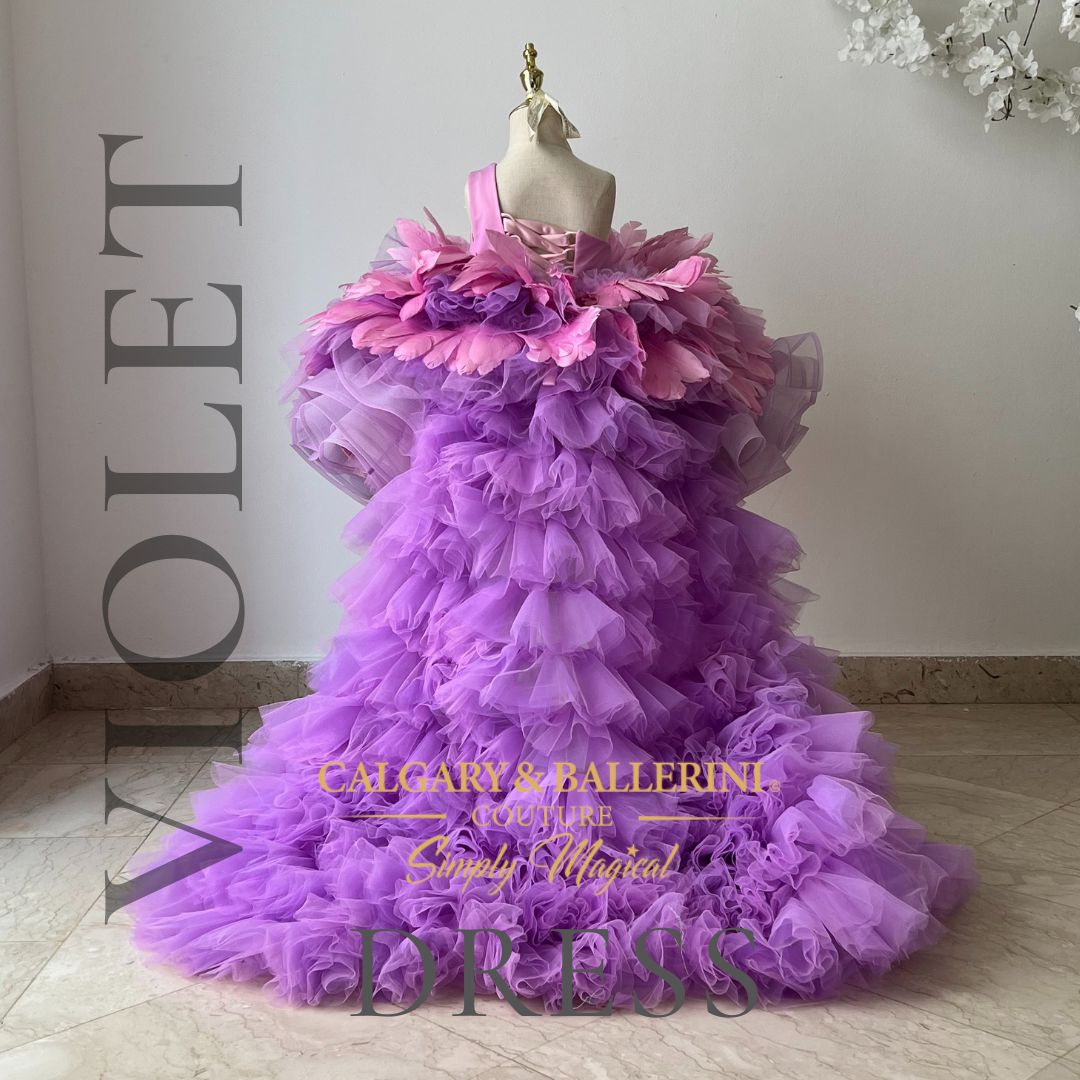 Charming flower girl attire: Lavender feather dress, a delightful choice for weddings, with an elegant train