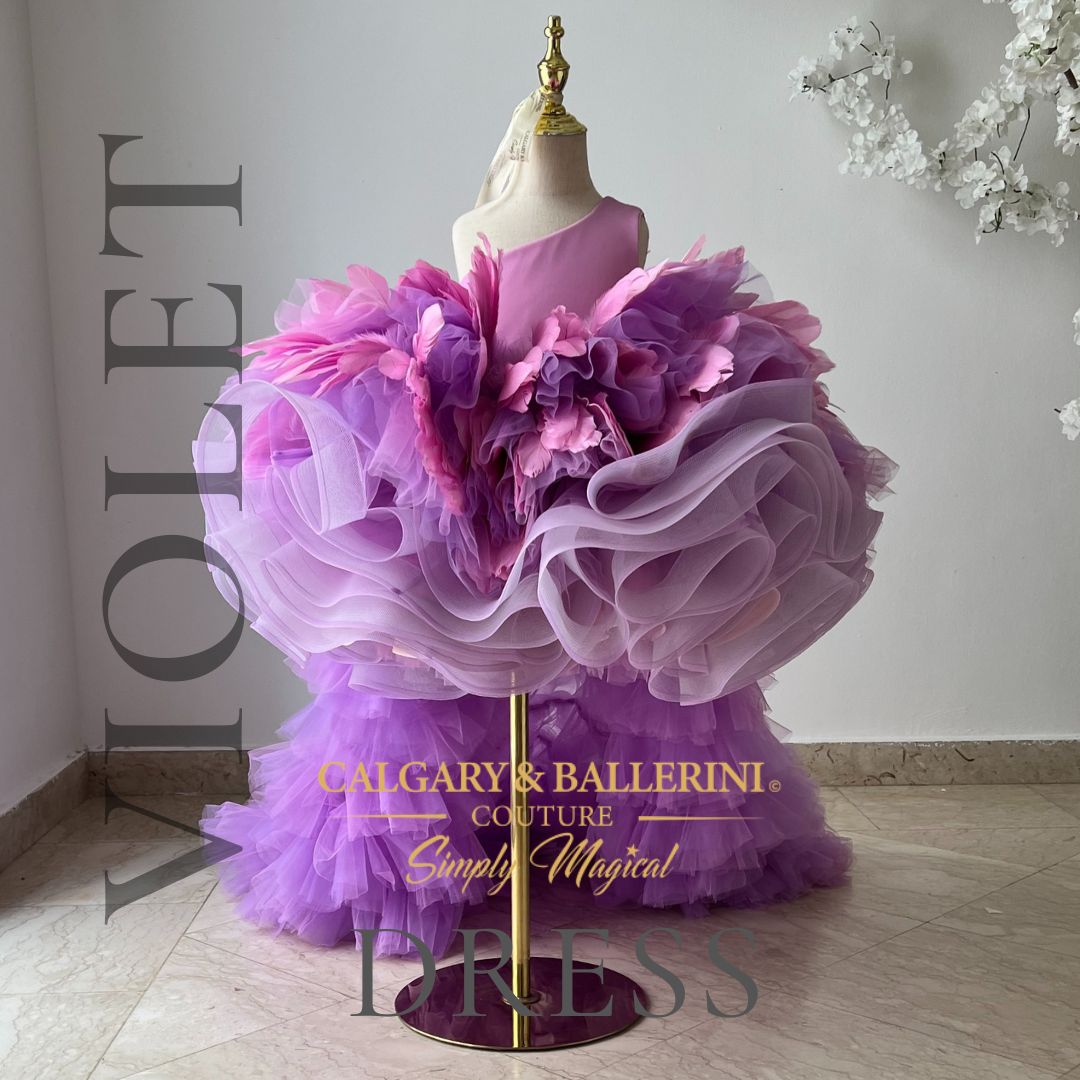 Feathered enchantment for weddings: Violet dress with cascading train, perfect for a flower girl's role.