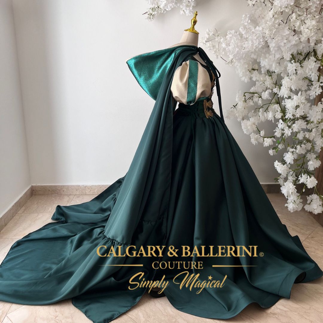 Where to buy handmade heirloom Emerald Celtic princess dresses with luxury capes and artisan embroidery. Shop Artisan Emerald Green Velvet and Gold Embroidery Detail – Close-up of Handmade Celtic Luxury Ball Gown for Professional Portraits, Calgary and Ballerini.
