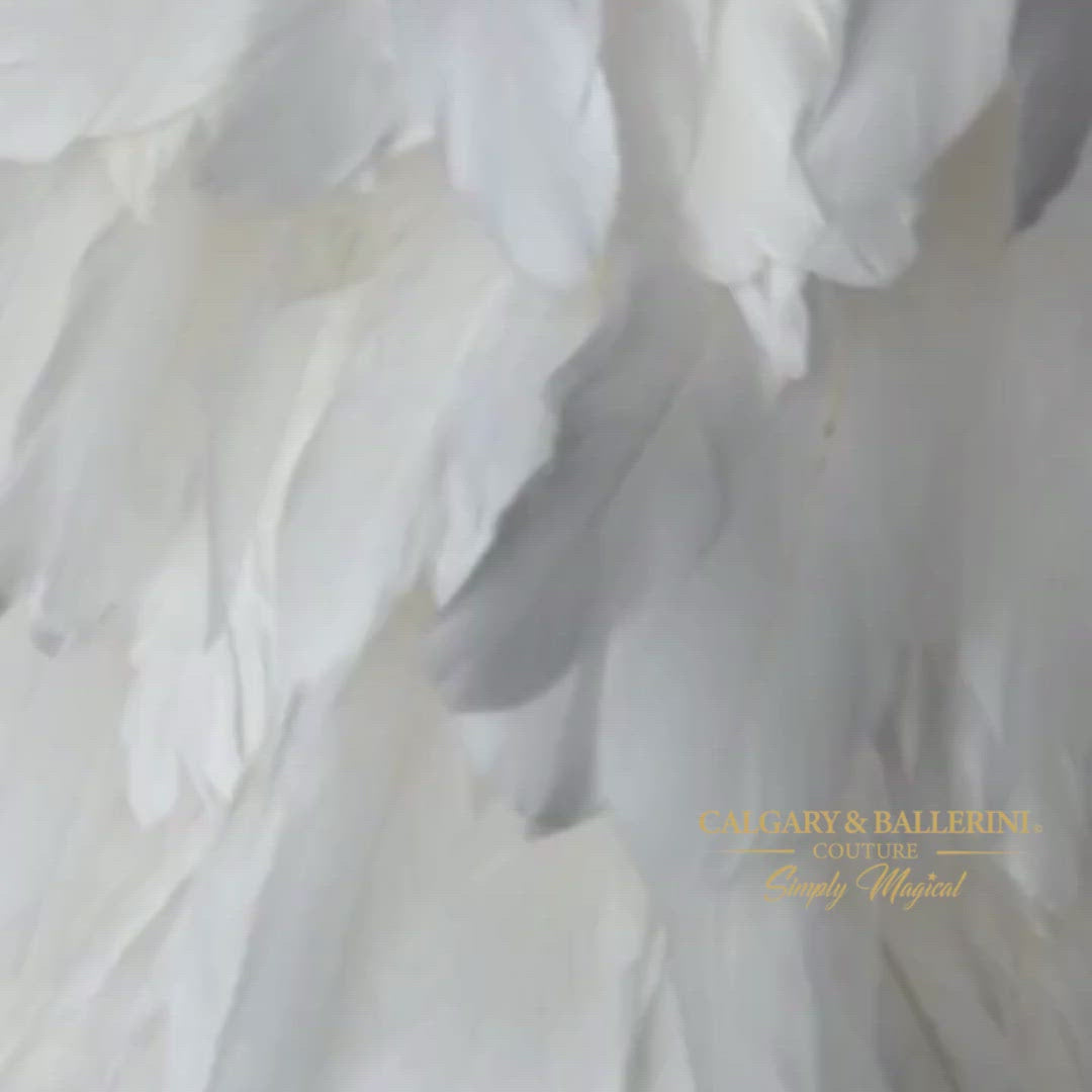 From pageants and baptisms, to fancy birthday parties and photoshoots, this designer's pick of a feather dress for teenage girls is sure to steal the show with its' luxurious style and chic design. The off-white Snow White hue adds that extra touch of elegance which 