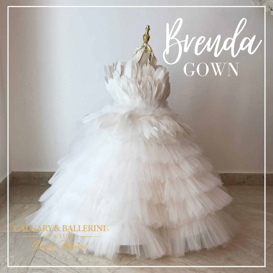 Let your little girl be a white swan for the first communion ceremony with the Brenda Gown. Featuring a white feathery bodice and sweeping ruffled tulle skirt