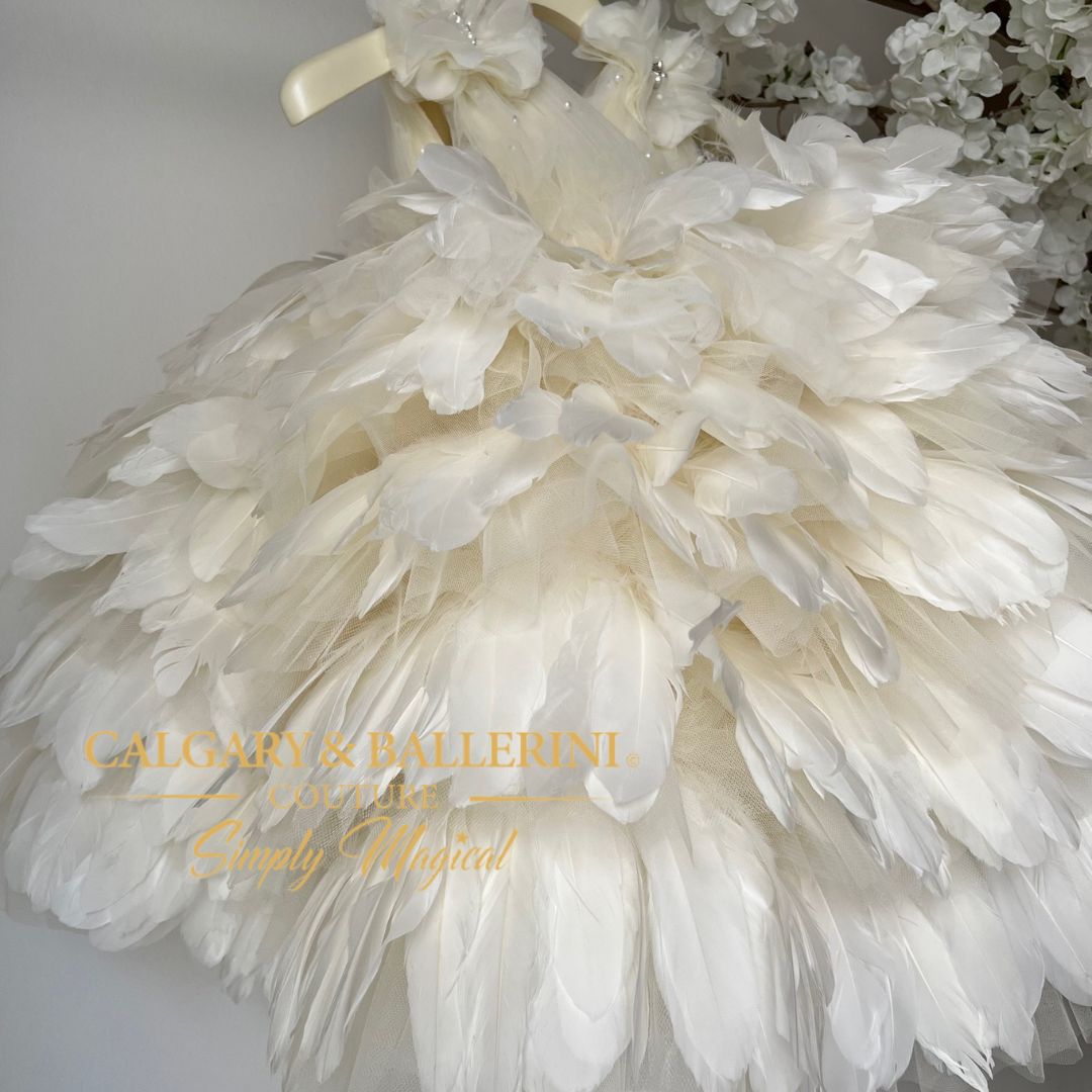 Elegantly crafted to fit your child's individual measurements, this couture feather dress