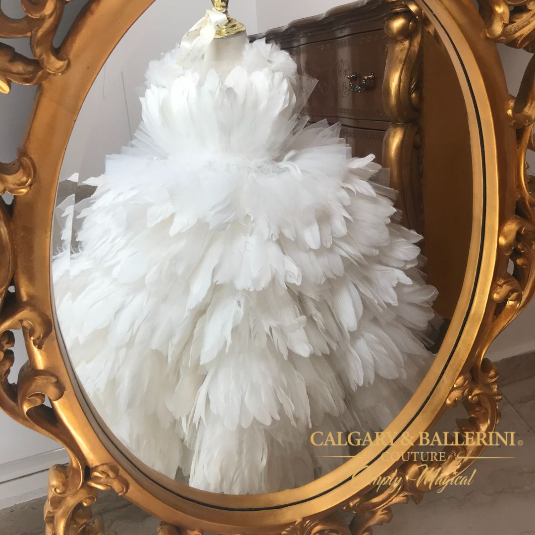 From pageants and baptisms, to fancy birthday parties and photoshoots, this designer's pick of a feather dress for teenage girls is sure to steal the show with its' luxurious style and chic design. The off-white Snow White hue adds that extra touch of elegance which makes it an easy choice for flower girl 