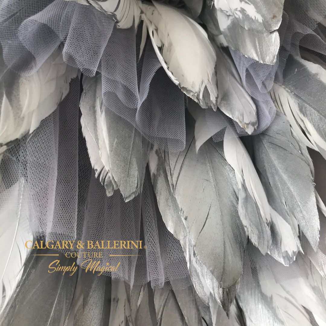 This gorgeous silver feather dress with silver rhinestone accents is perfect for any special occasion including holidays, flower girl dresses, or even bridal wear.