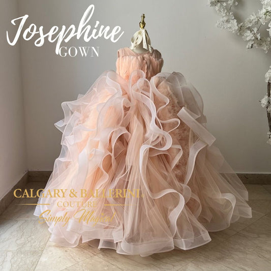 Whether celebrating an important 10th birthday or being part of a wedding ceremony, this peach flower girl dress will ensure she sparkles and shines like never before.
