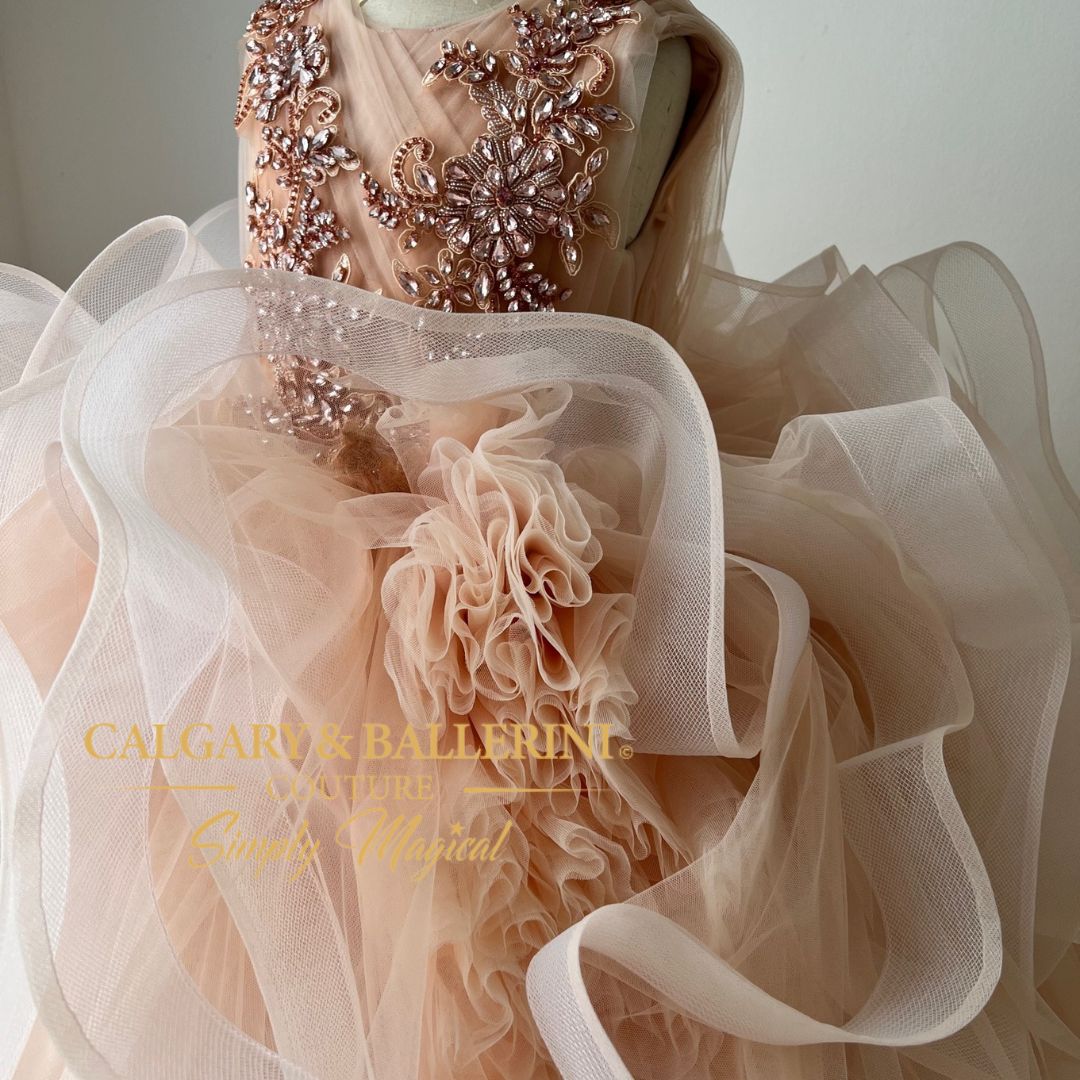 Imagine your daughter walking down the aisle in our peach tulle dress!