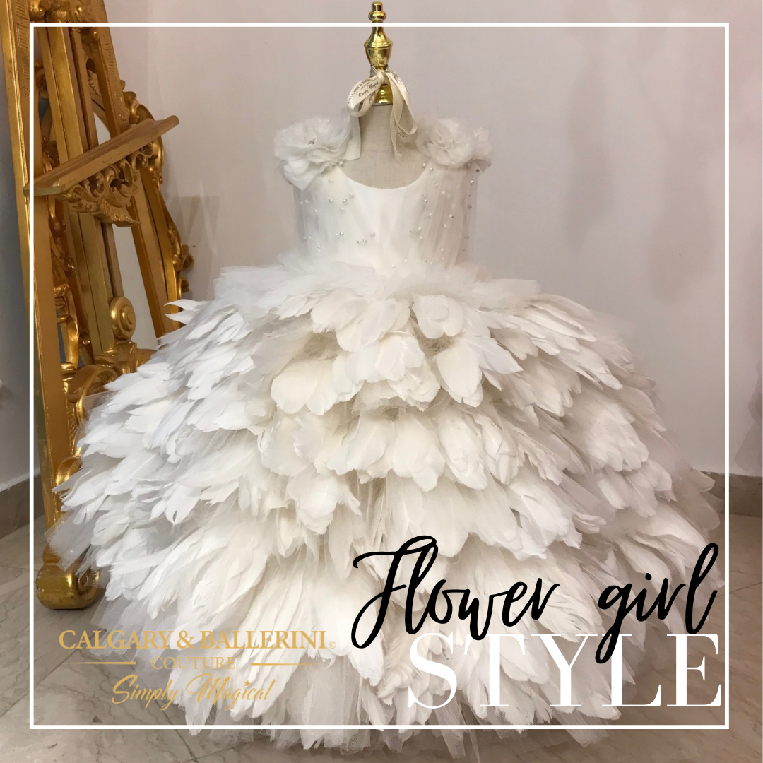This angel gown feather dress set will make your little one feel like a true princess. The luxurious dress features a pearl tulle pleated bodice, handmade shoulder flowers, and feather accents. Add a touch of elegance and whimsy to any special occasion with the angel feather gown 