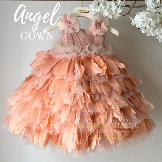 peach feather dress on hanger