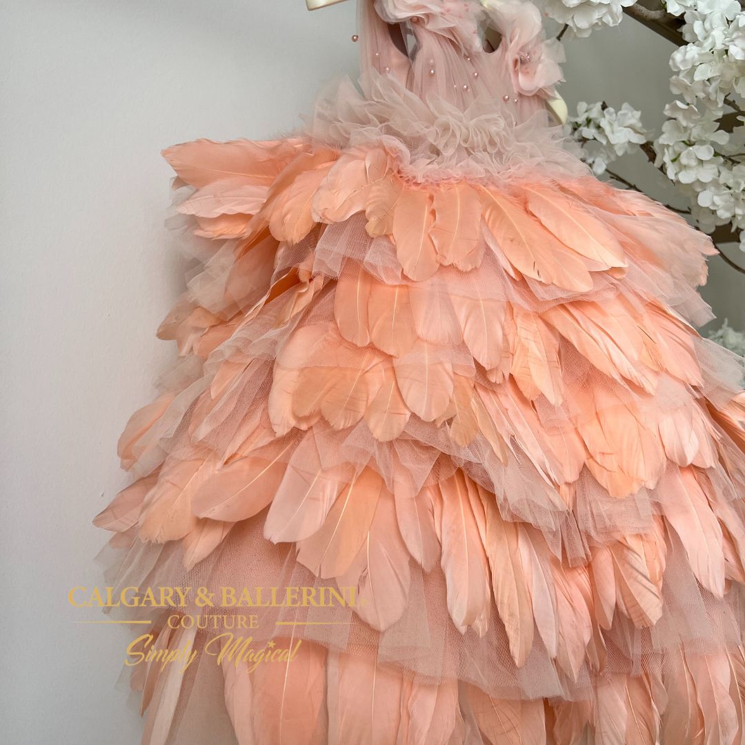 side view peach feather dress on hanger 