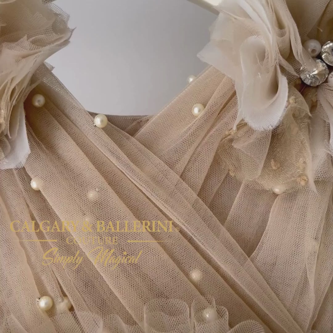 It's also ideal as a flower girl or birthday dress, with delicate details that never fail to dazzle onlookers. Tailored to perfection and offering unique style, this couture feather dress in gold