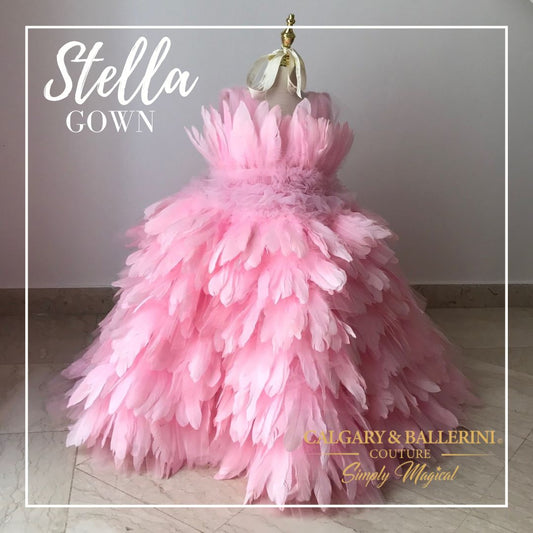 Our custom-made luxury gown is designed for brides and flower girls aged 1 to 12 years, adding a touch of elegance and whimsy to any wedding celebration. Embrace the beauty of feathers and make a statement on your special day. Explore our collection today and let your wedding fantasies take flight