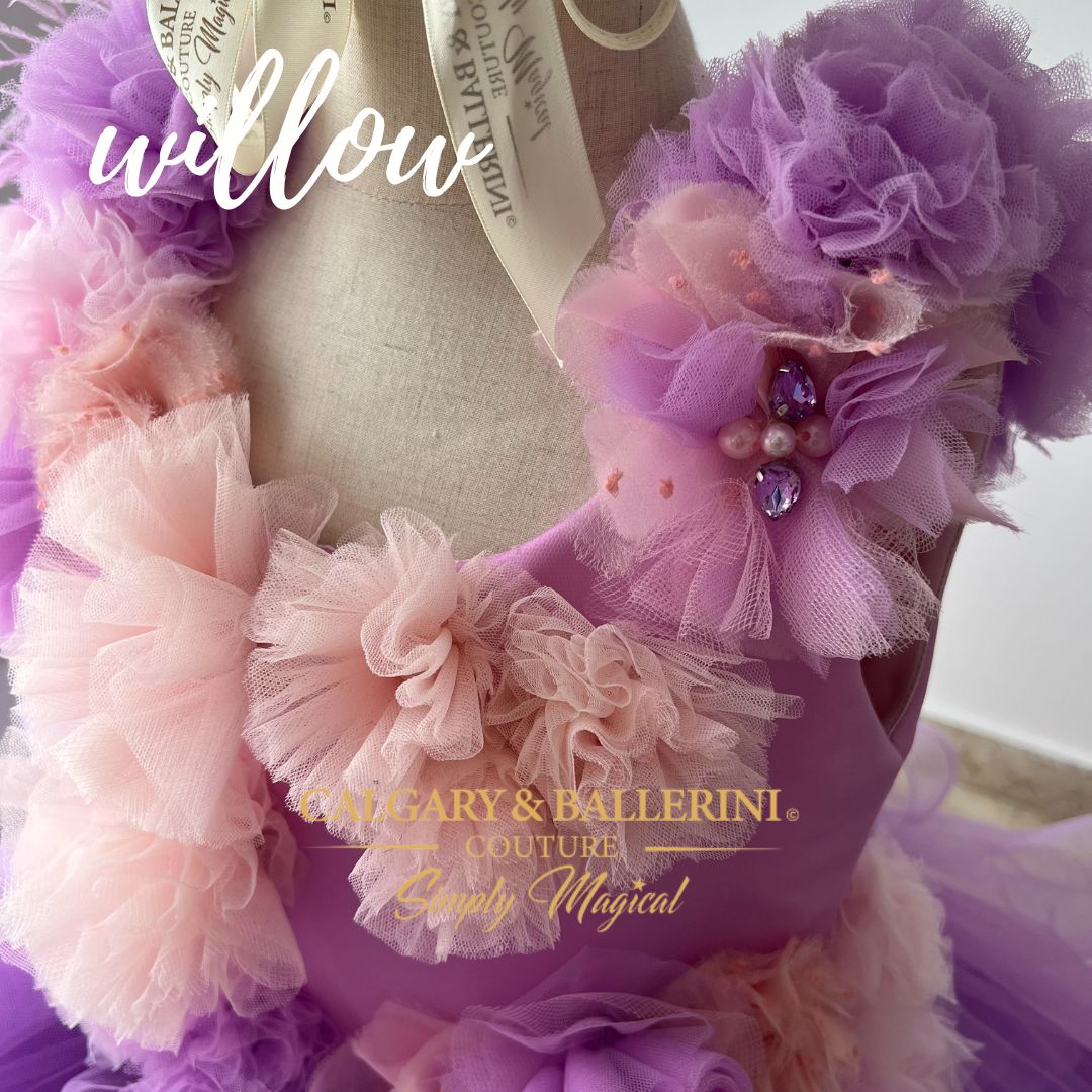 Handmade purple ball gown with ruffles and a flowing cape for flower girls.