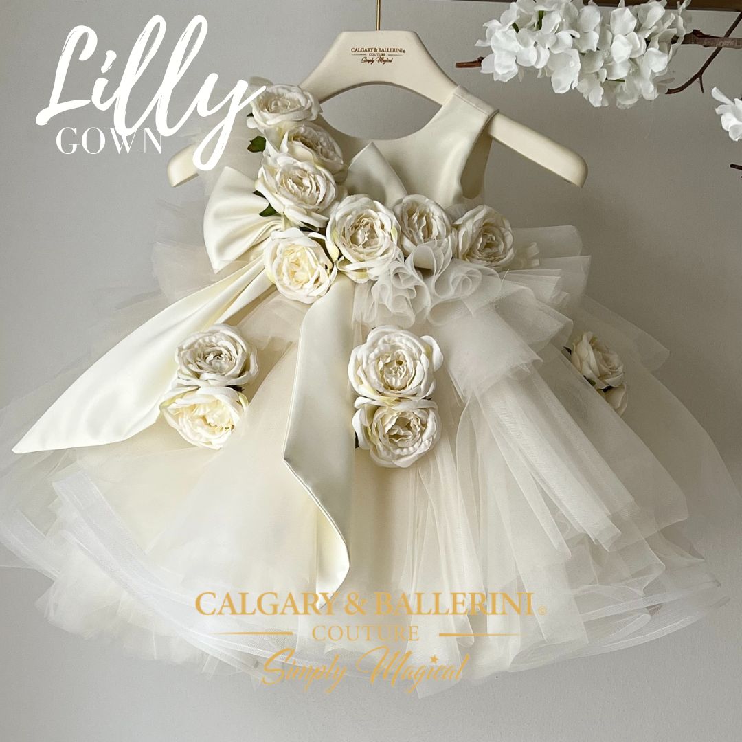 Experience pure elegance with our stunning Lilly Roses Ball Gown in color Vanilla. This captivating flower girl dress is meticulously crafted with attention to every detail. The exquisite lace bodice is adorned with intricate floral appliques, adding a touch of charm and sophistication.