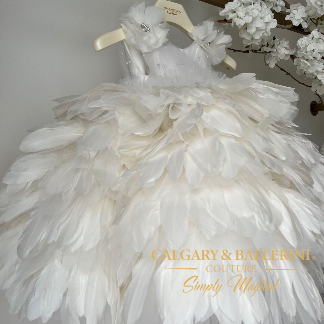 Floor-length white feather dress for toddlers, featuring genuine goose feathers and a satin bodice for formal events