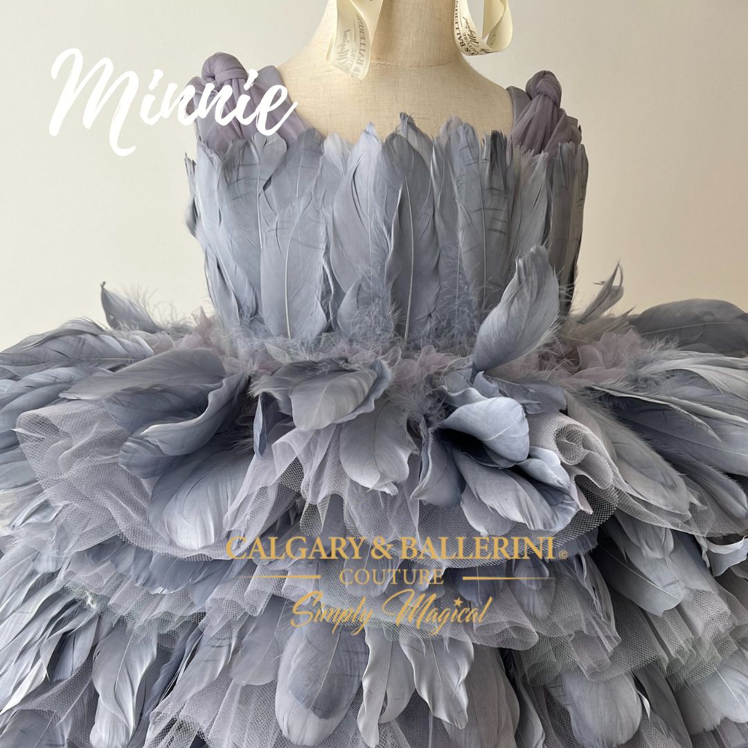 Discover our luxury Feather Dress Collection for girls aged 1 to 12 years. Perfect for character-themed birthday parties and weddings, our knee-length Feather Dress, Minnie, in platinum blue is a stunning choice