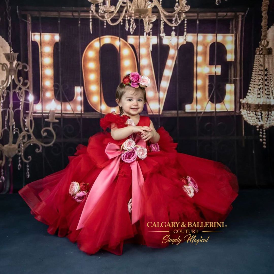 For the special little valentine in your life, there is no better dress than our ROSE gown. The light, ruby red color of this valentines dress will capture the eye and bring a smile to every face it meets. This tulle-ruffled floor length number will make your little one's first valentine's day or first birthday unforgettable! 