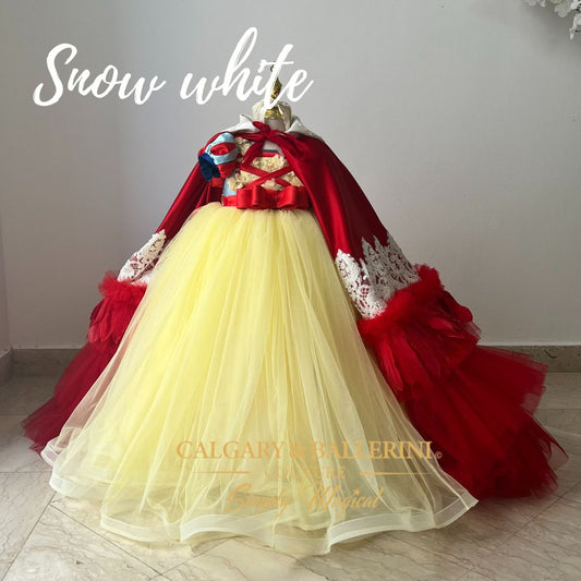 Snow White Costume. This floor length tulle luxury gown is perfect for any Snow White themed event! The cape features feather details and the character themed head piece completes the look.