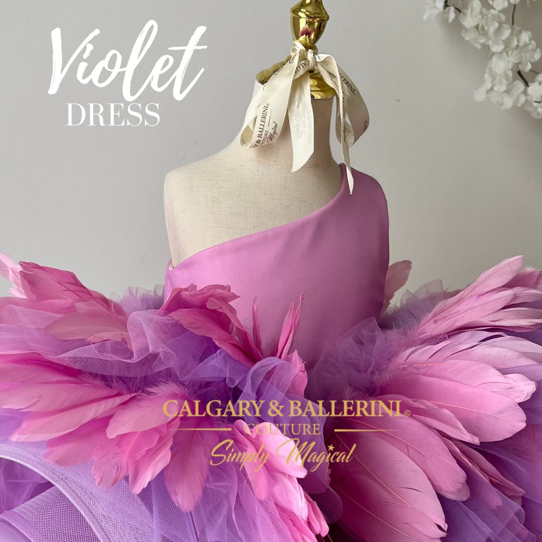 Elegance in motion: Flower girl wearing a feathered violet dress with a train, ideal for weddings